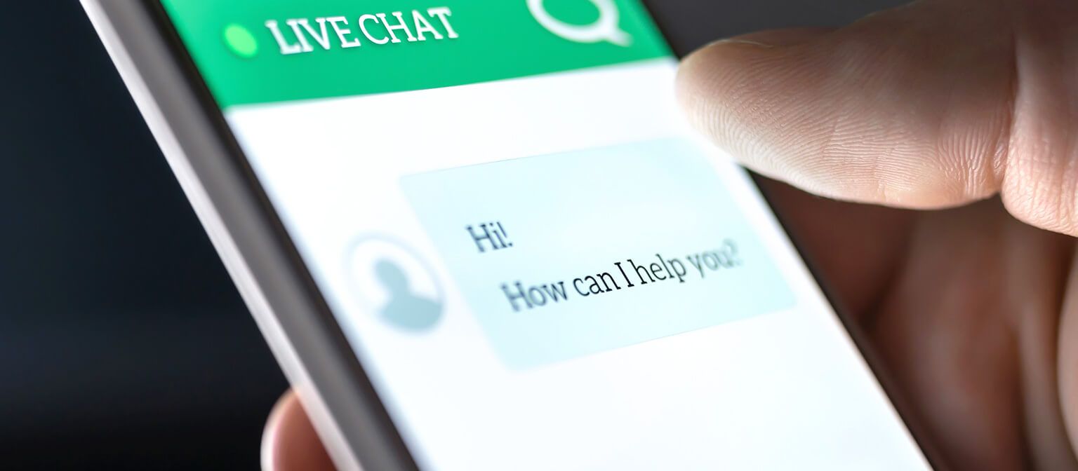 Close up image of mobile phone displaying live chat support