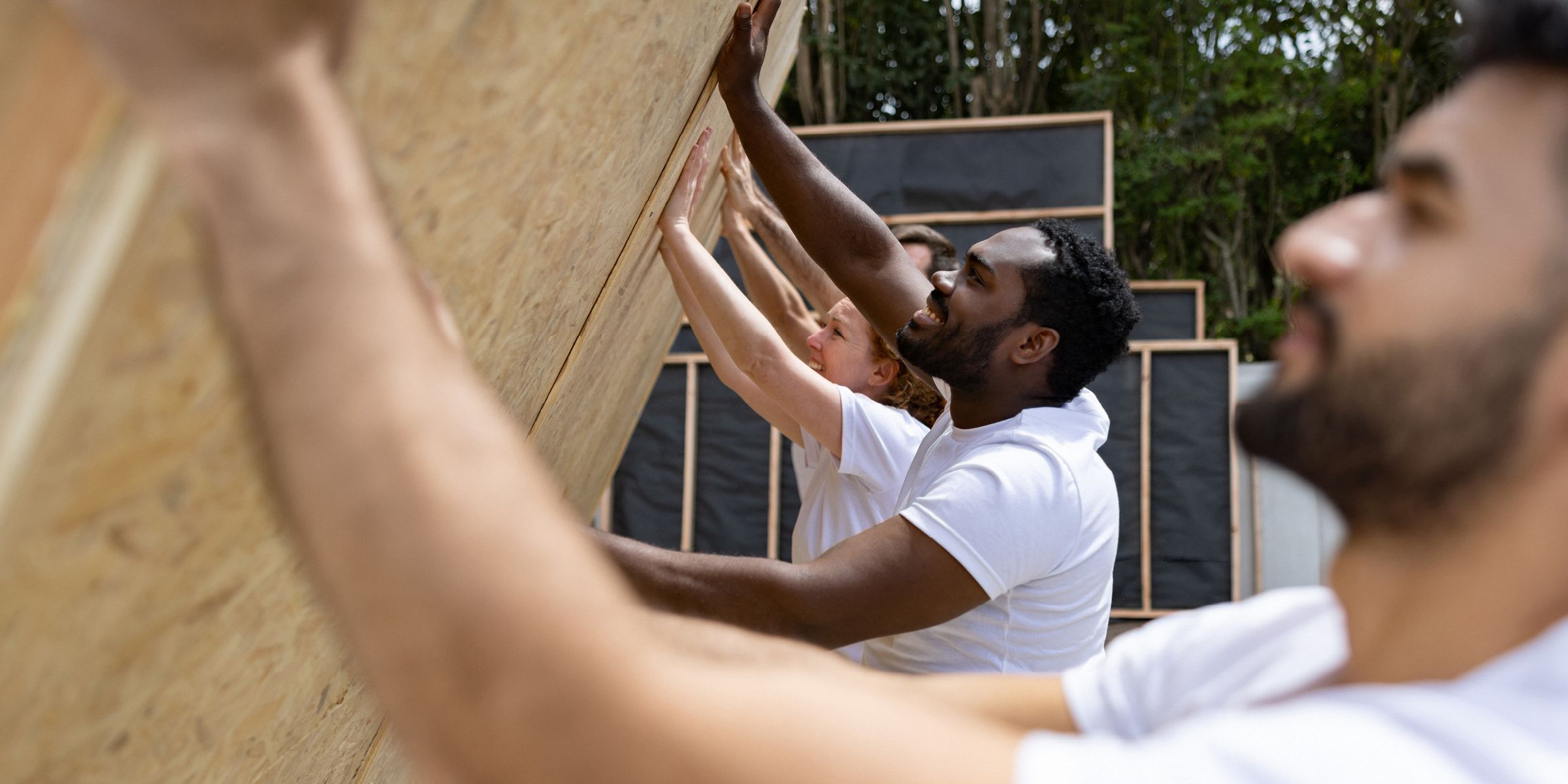 Volunteers painting and fixing up a house