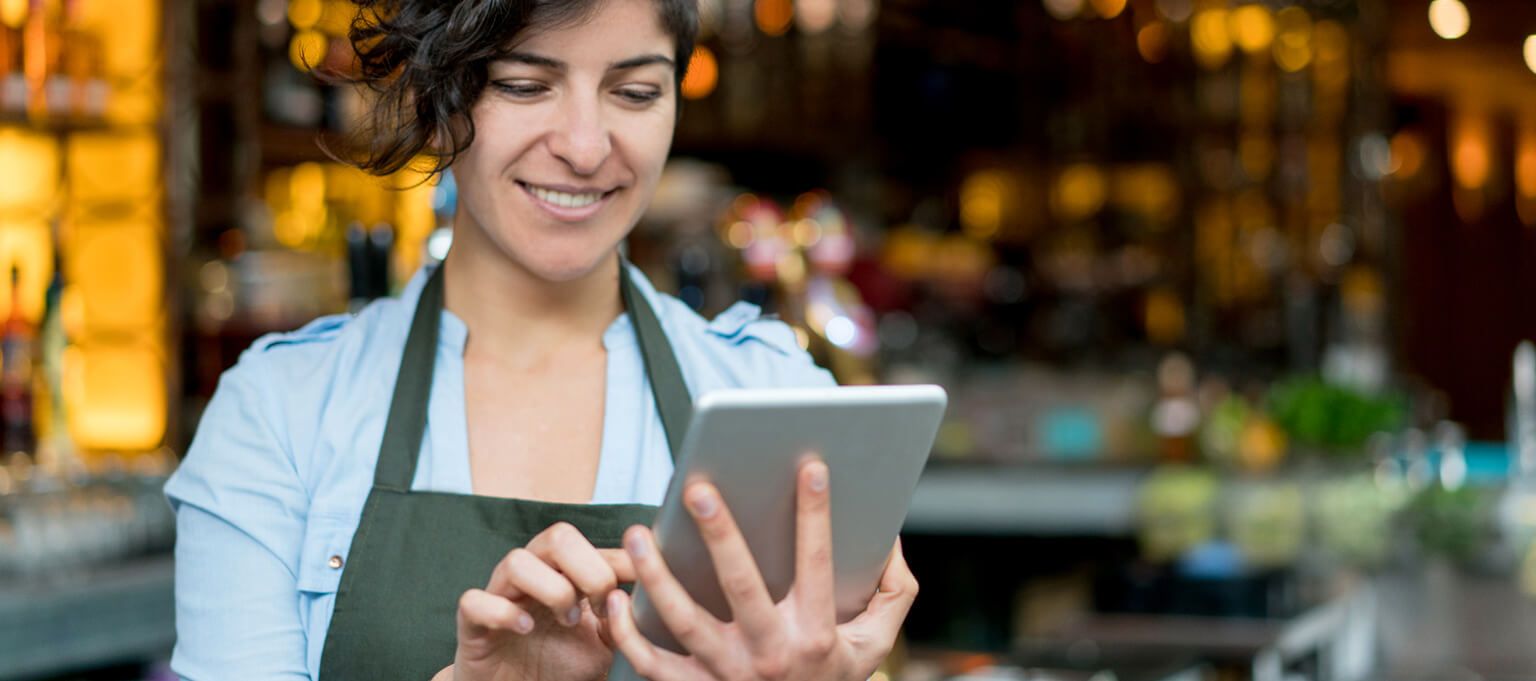 Woman holding tablet device