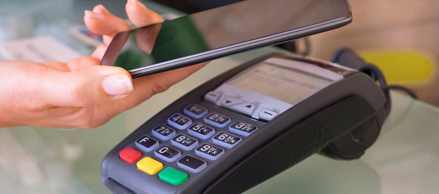 Woman using contactless payment