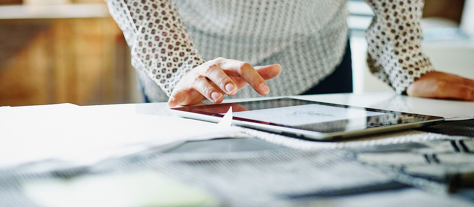 Woman working on tablet device