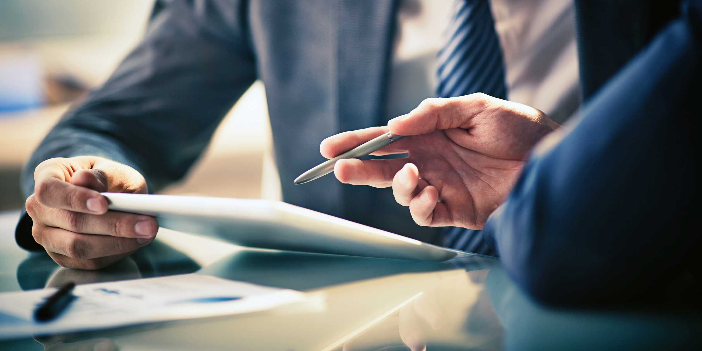 a person holding paper and pen