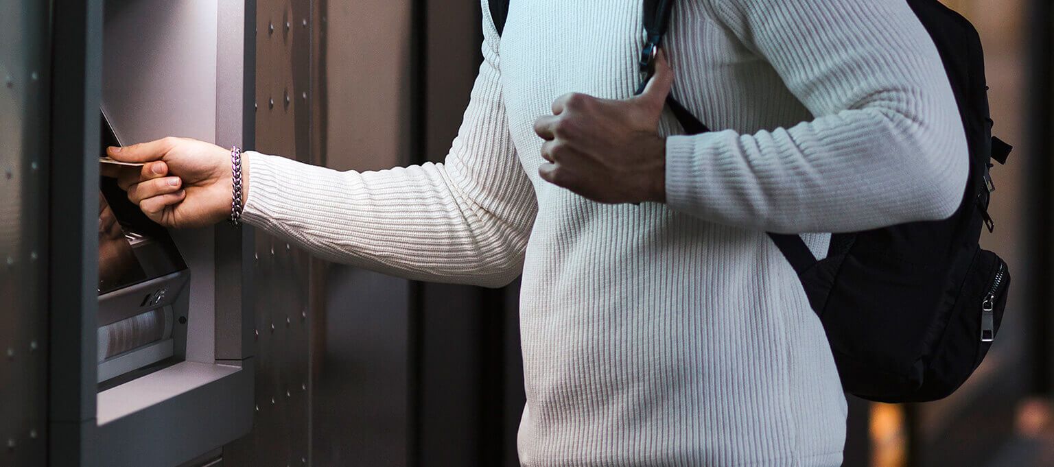 Man banking at ATM