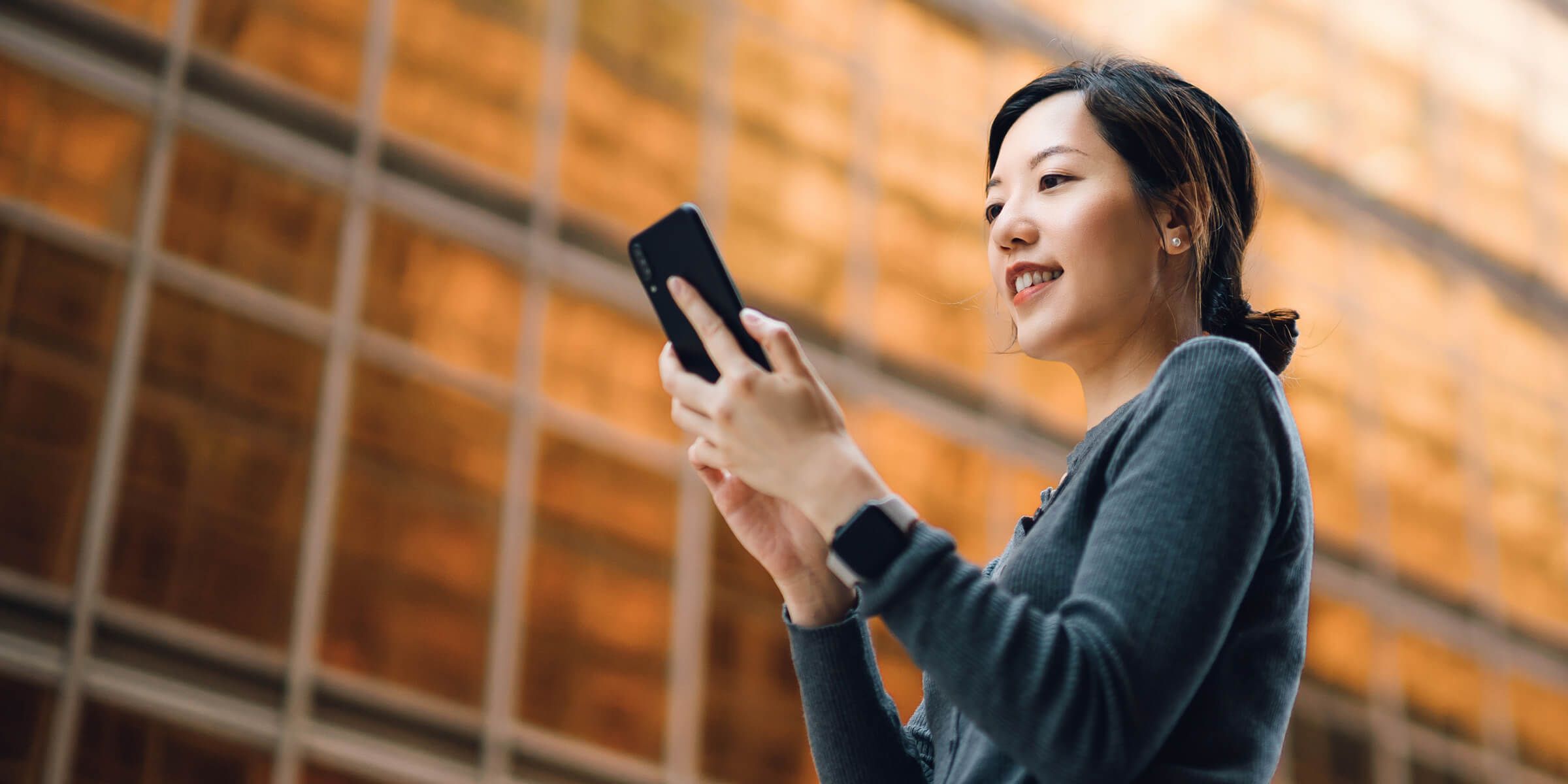 a woman holding a phone