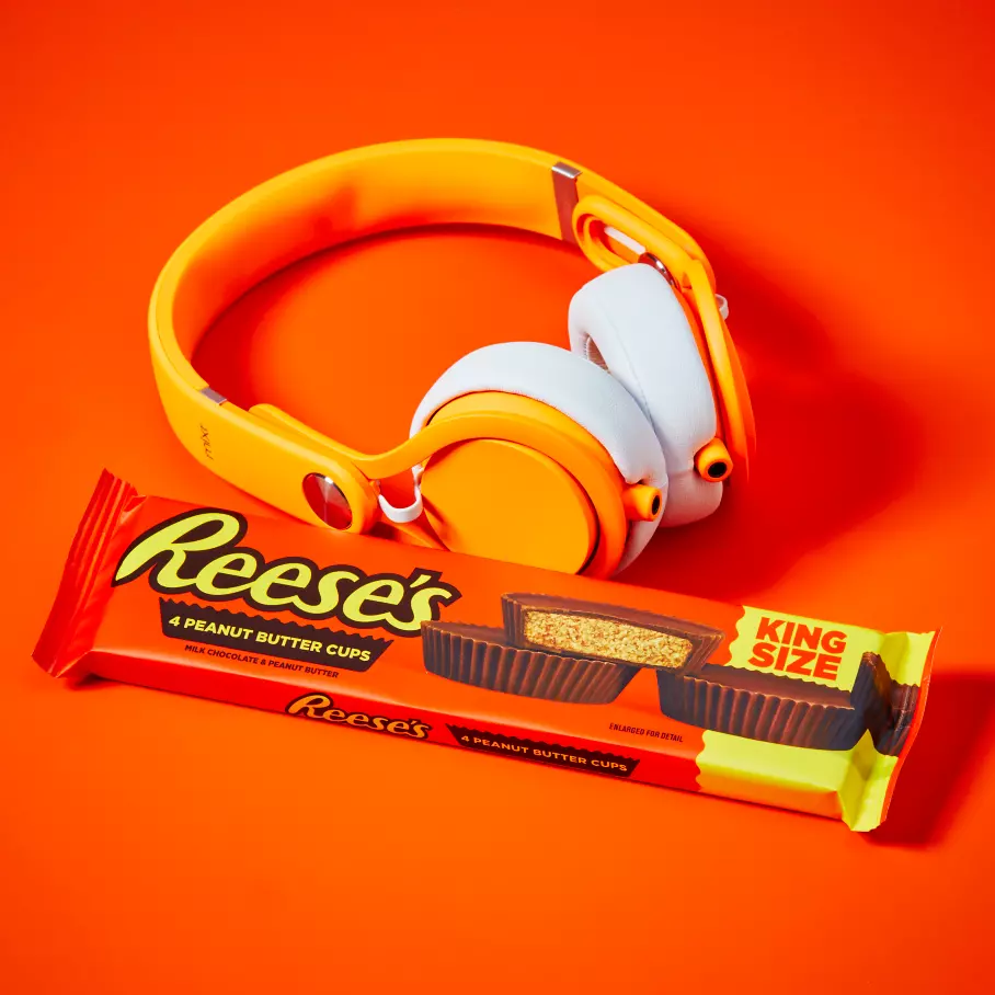 REESE'S Milk Chocolate King Size Peanut Butter Cups beside headphones