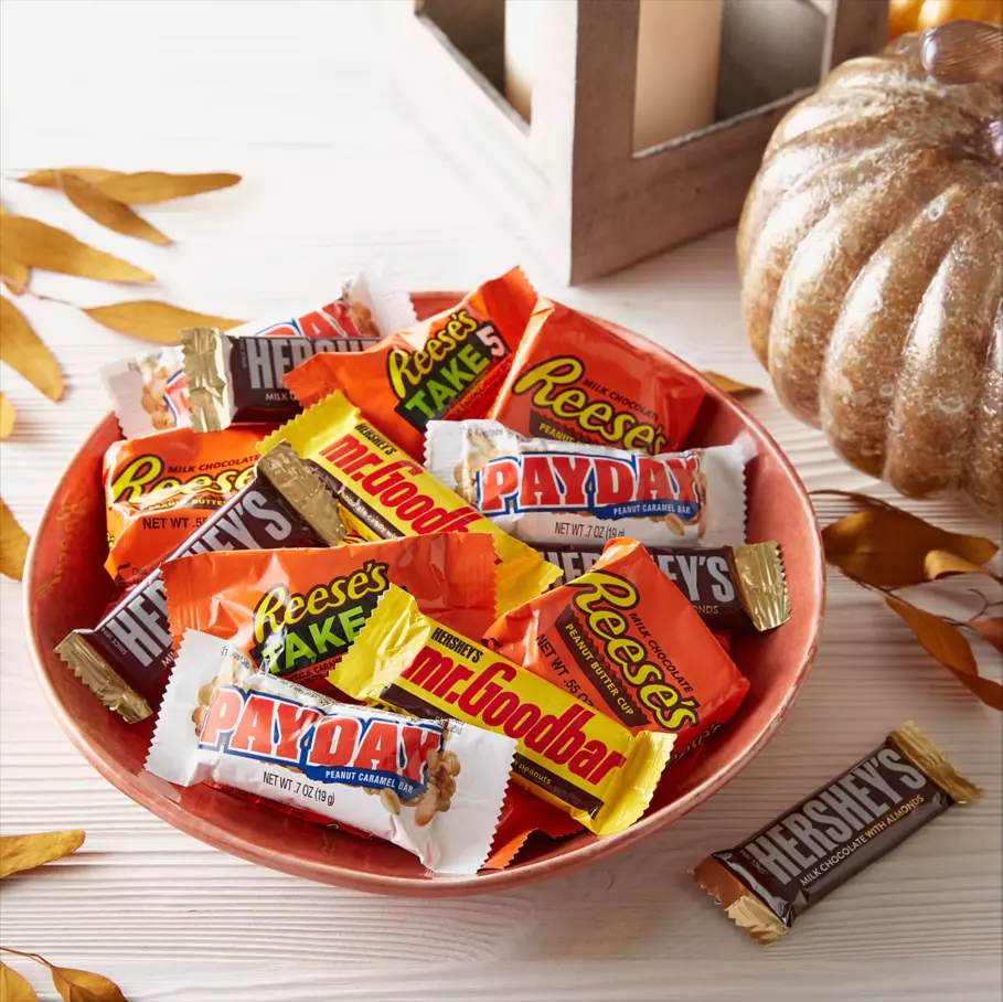 Assorted Hershey Candy inside halloween themed bowl