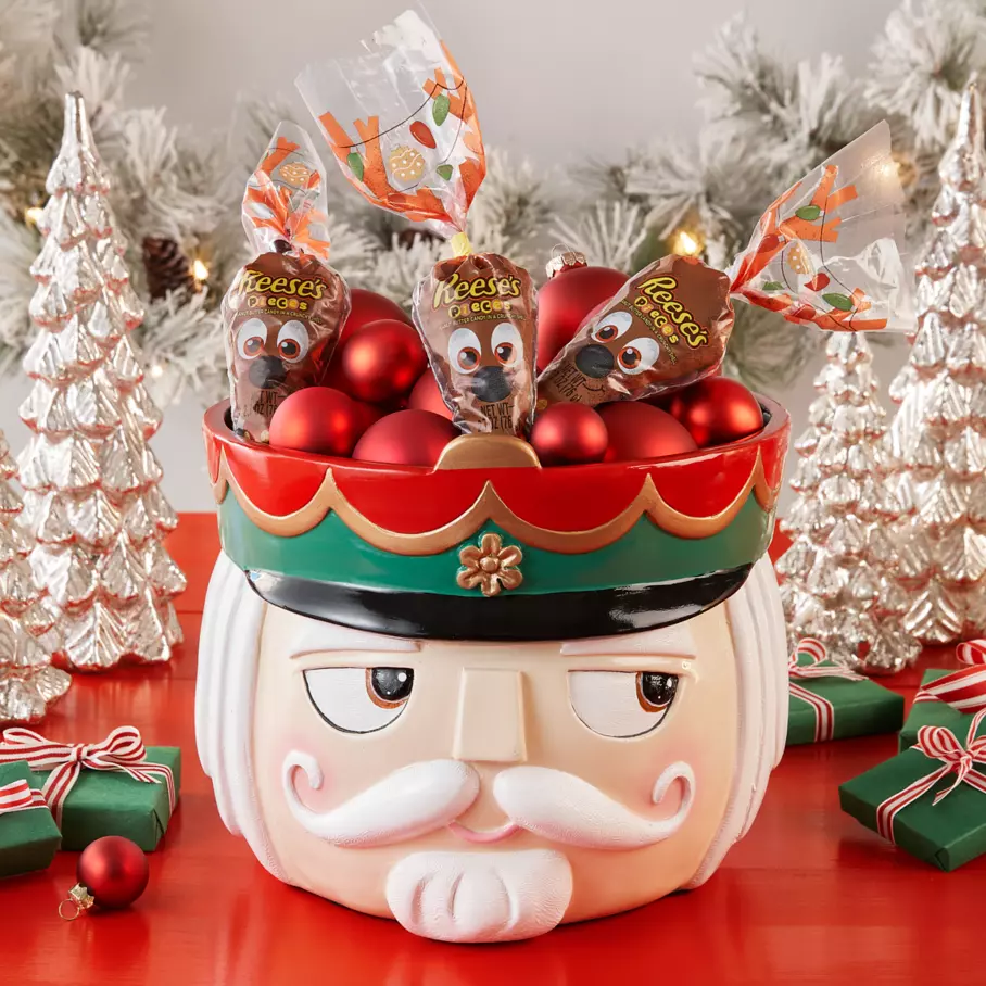 REESE'S PIECES Reindeer Candy Carrots inside nutcracker bowl surrounded by ornaments