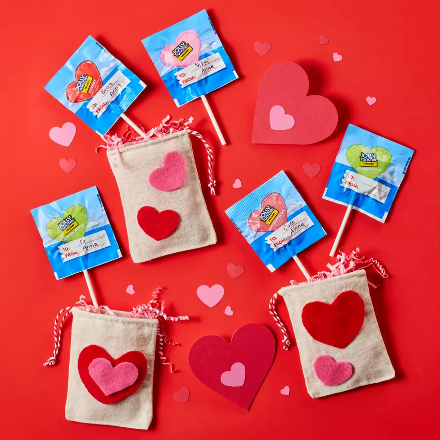 JOLLY RANCHER lollipops spread out on red heart background