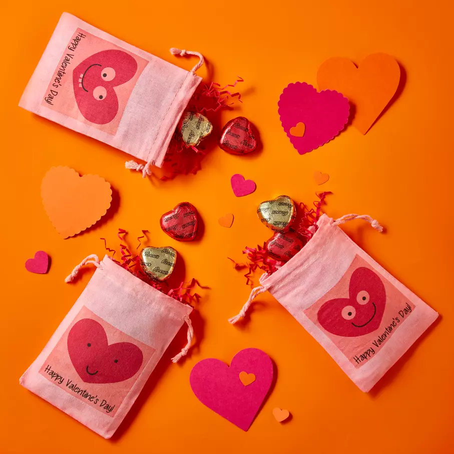 REESE'S hearts spread out on orange heart background