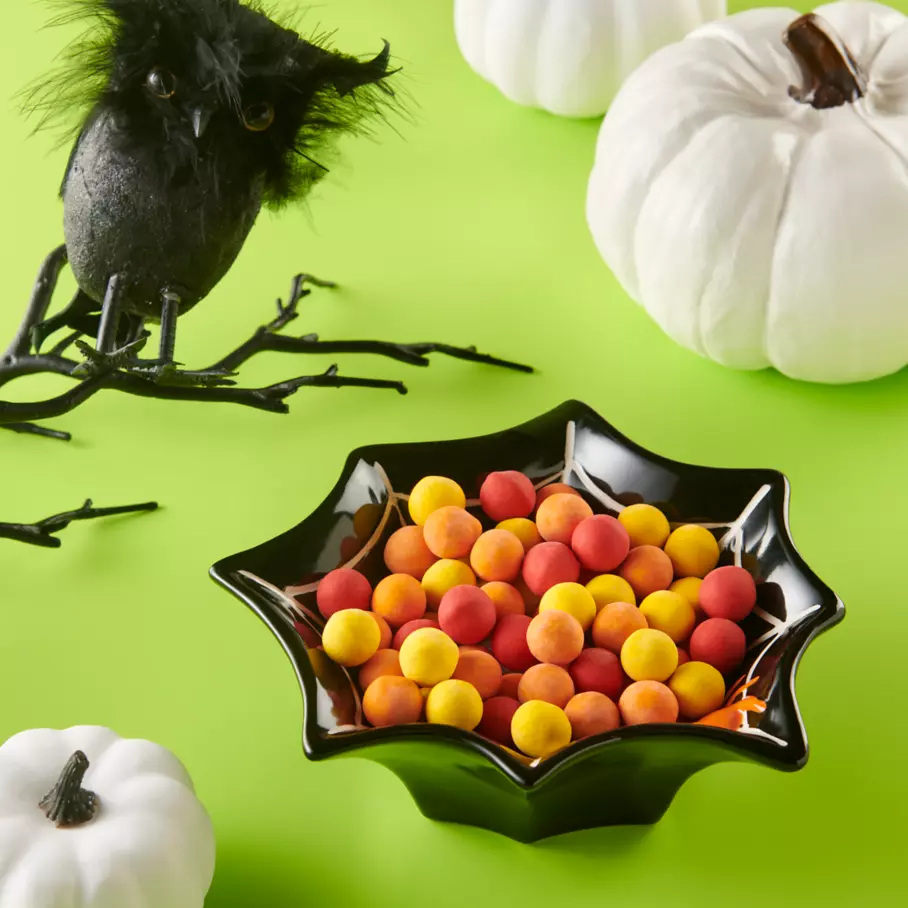 Halloween spider bowl filled with CADBURY Mini Harvest Candy
