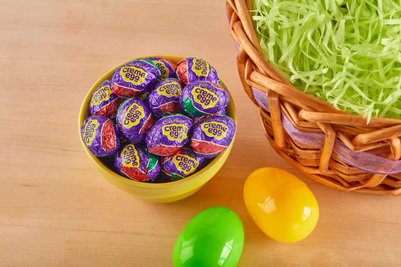 Cadbury Creme Eggs beside Easter basket