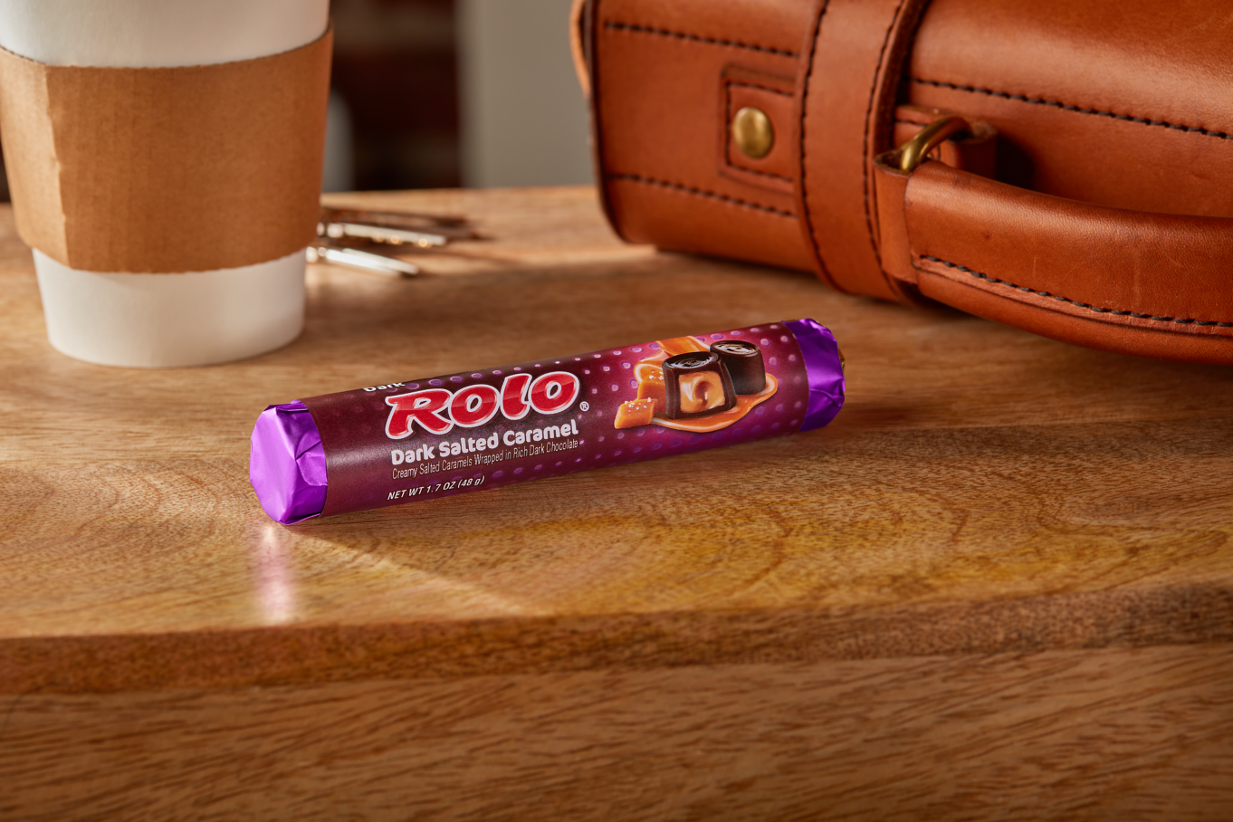 ROLO® Dark Salted Caramel Roll beside coffee cup