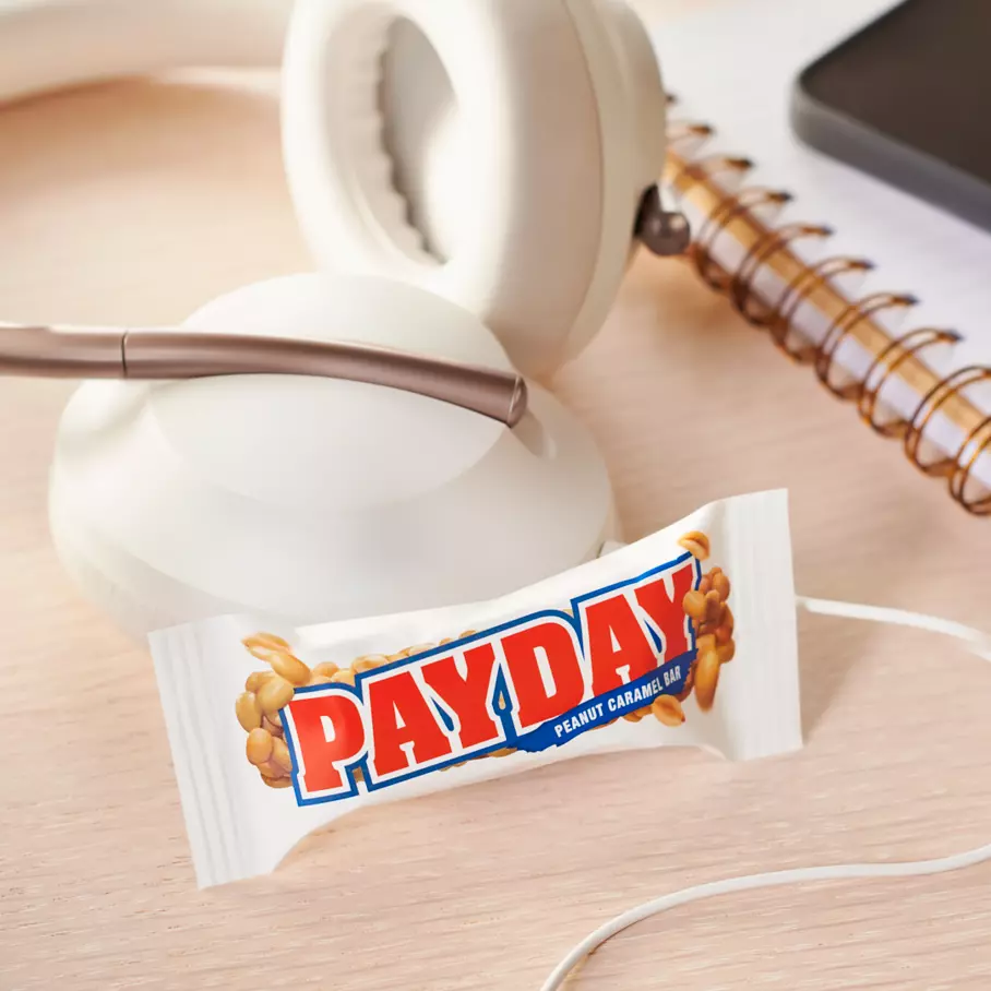 PAYDAY Candy Bar beside headphones