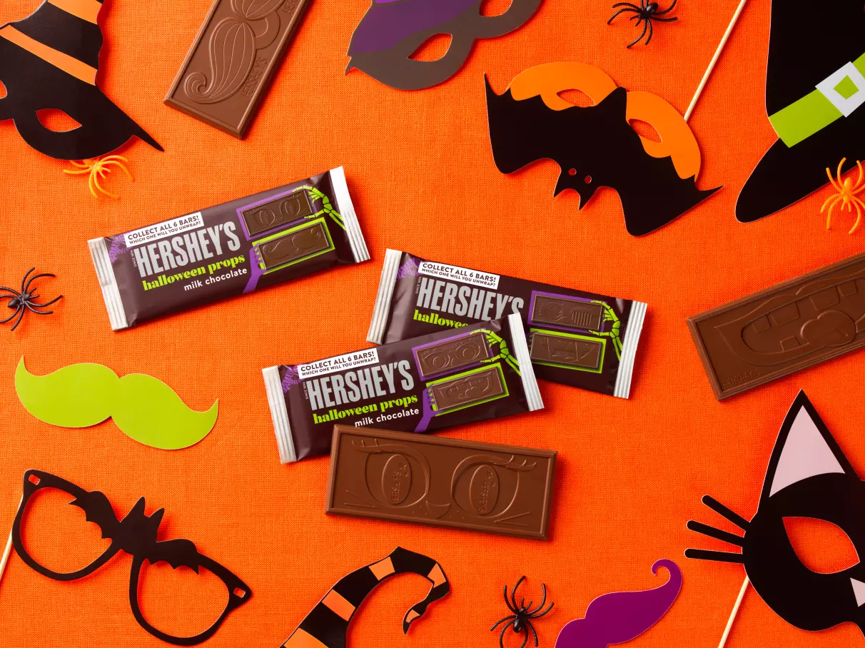 HERSHEY'S Halloween Props Candy Bars surrounded by party props