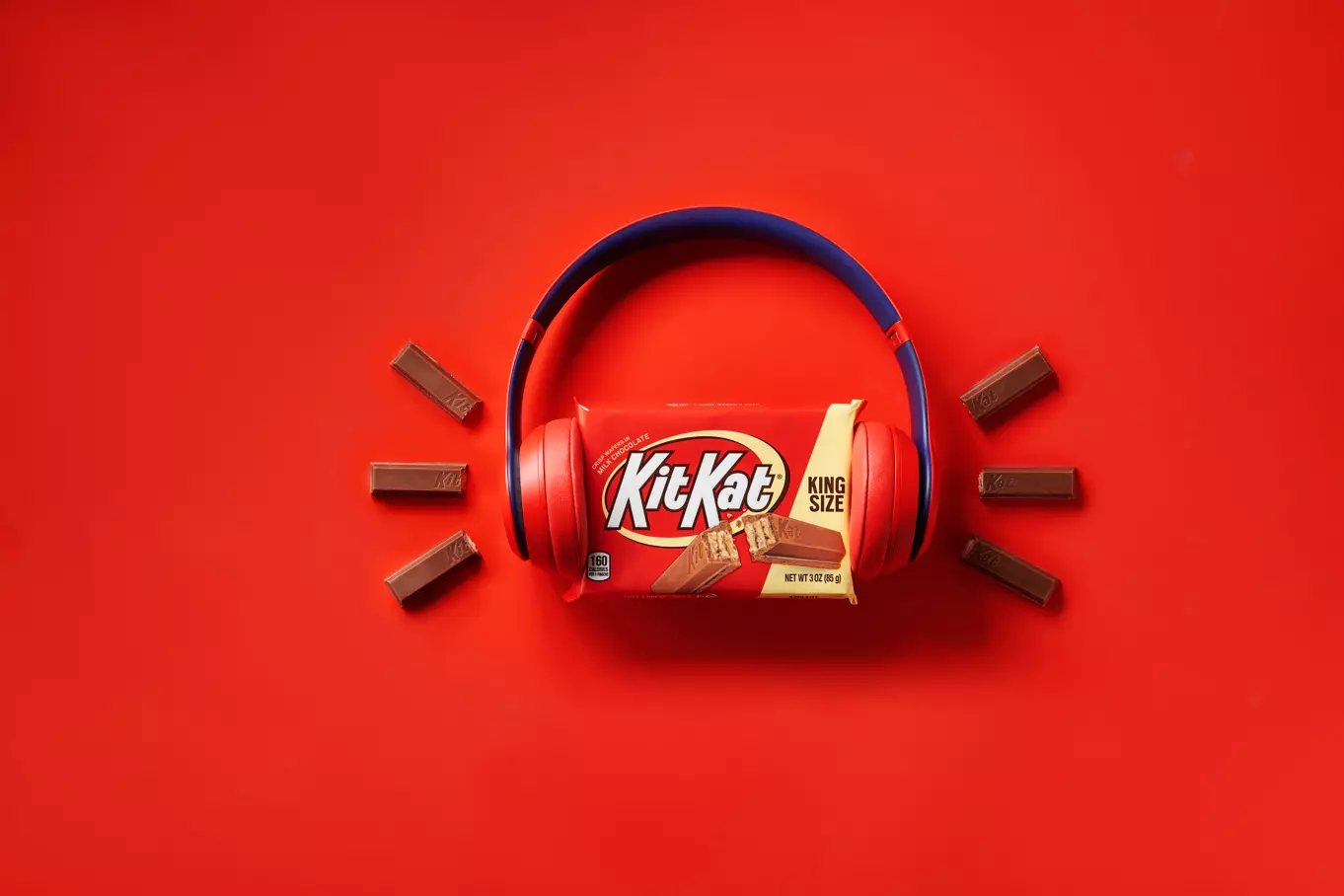 KIT KAT® Milk Chocolate Candy Bars beside headphones