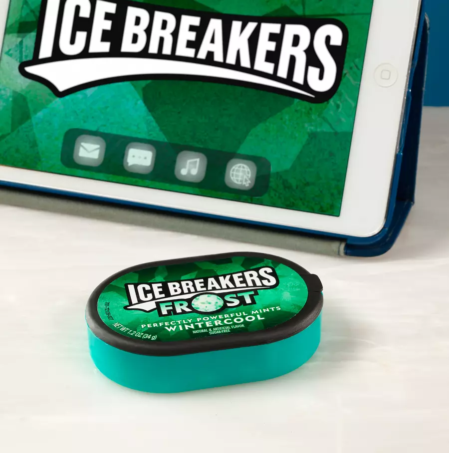 pack of ice breakers frost next to tablet on table