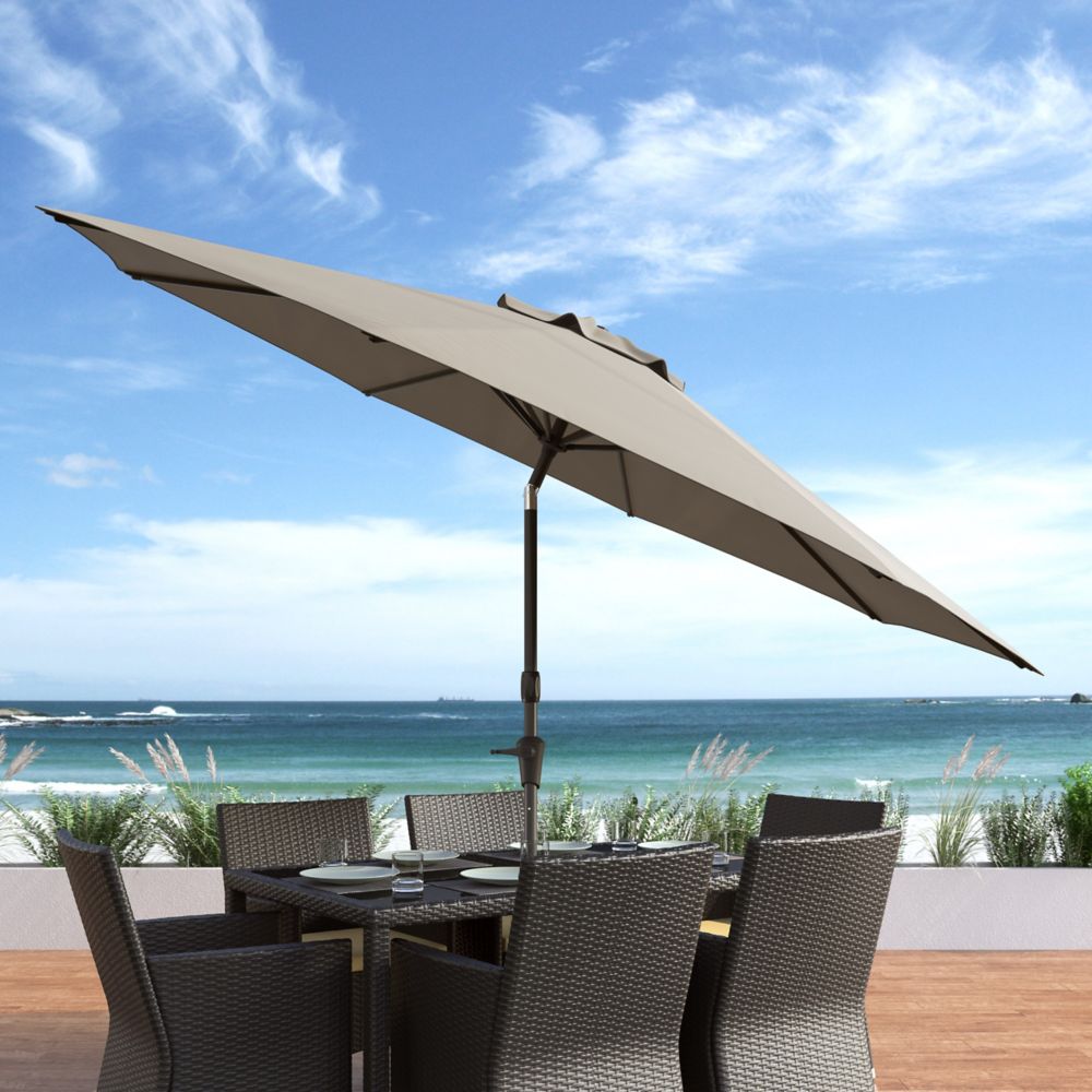 brown patio set with umbrella