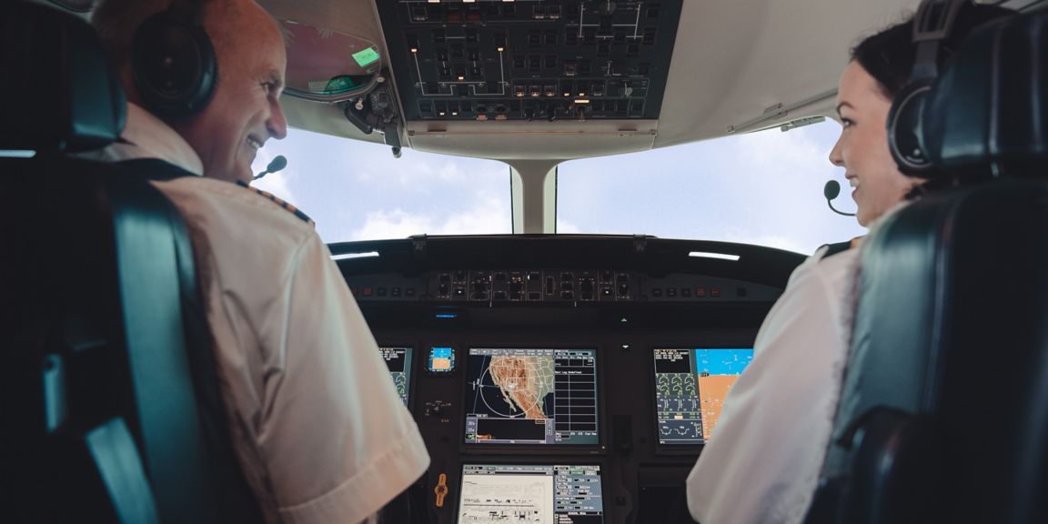 Pilot and copilot in airplane cockpit