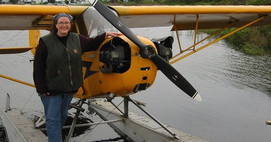 Thea beside a plane