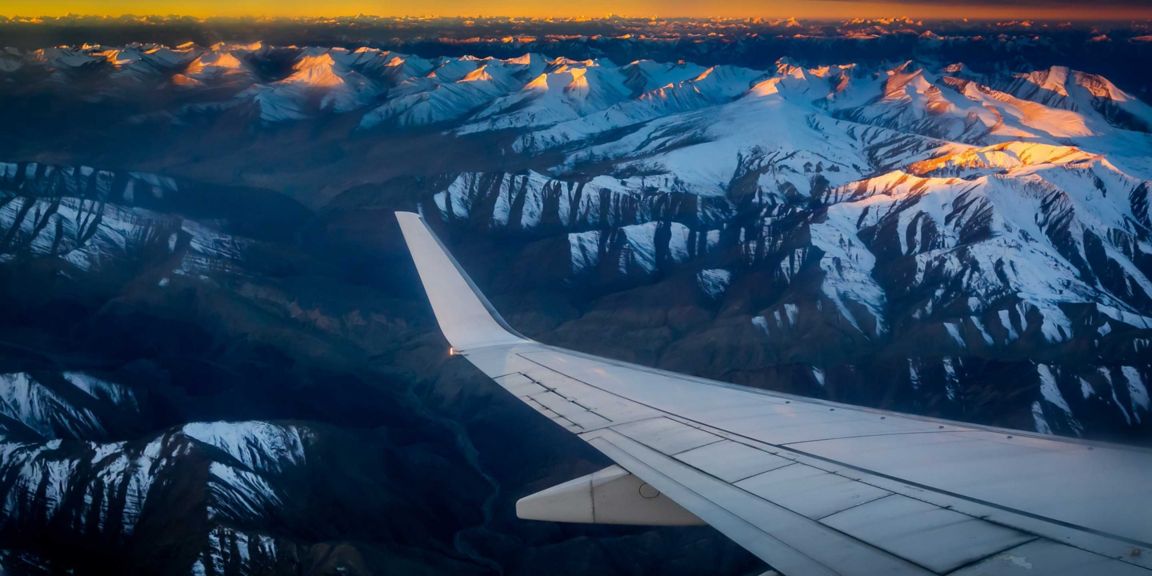 Plane wing at sunset