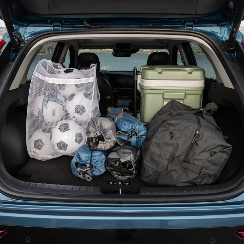  2024 Kia soul rear trunk opened with large amounts of sports equipment