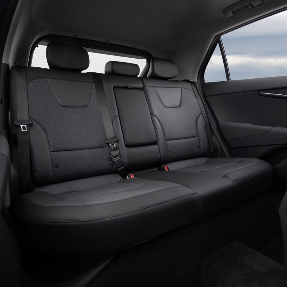  Back seat view of the black leather interior in the Kia Niro EV