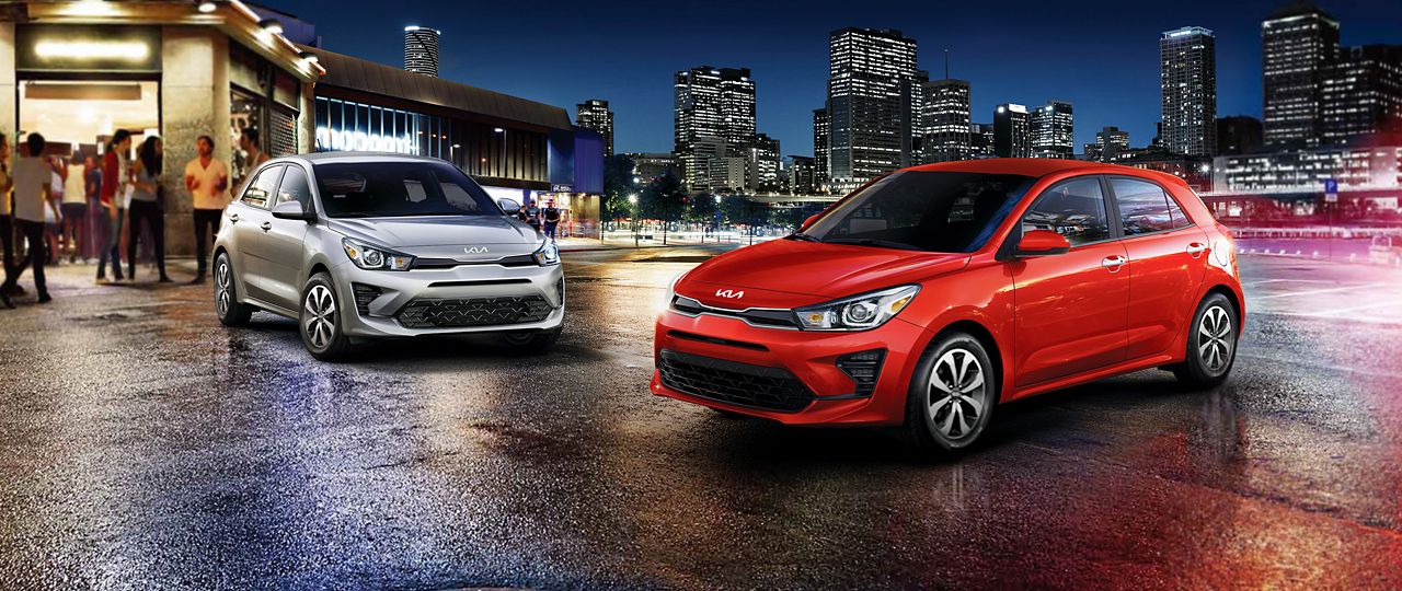 2023 Rio 5-Door, two side-by-side with a silver one in the background and a red on in the foreground