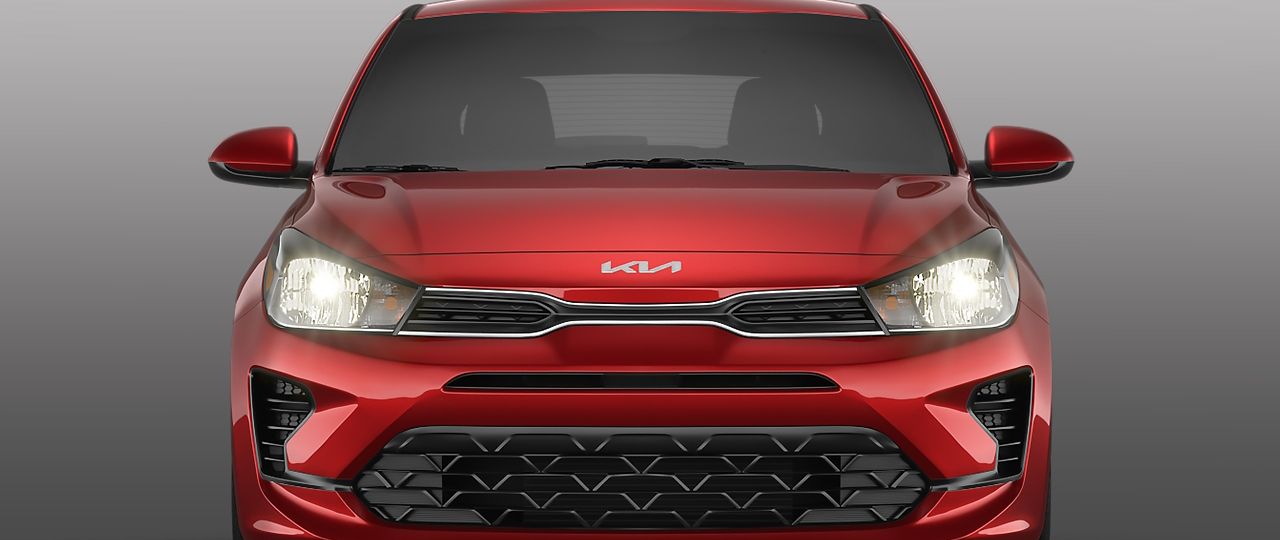 2023 Rio 5-Door in red, front view of LED headlight design
