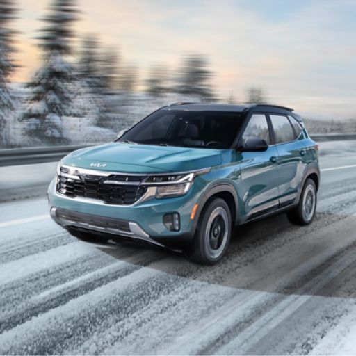 2024 Kia Seltos Utilizing Its Torque Vectoring All-Wheel Drive System on Icy Roads Three-Quarter View
