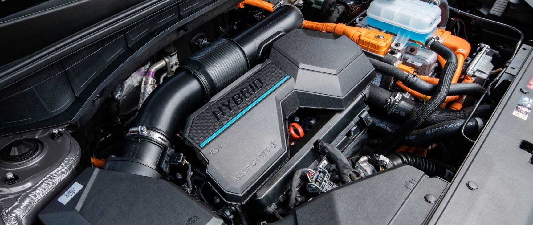  2024 Sorento Hybrid engine bay showing the engine cover and cold air intake