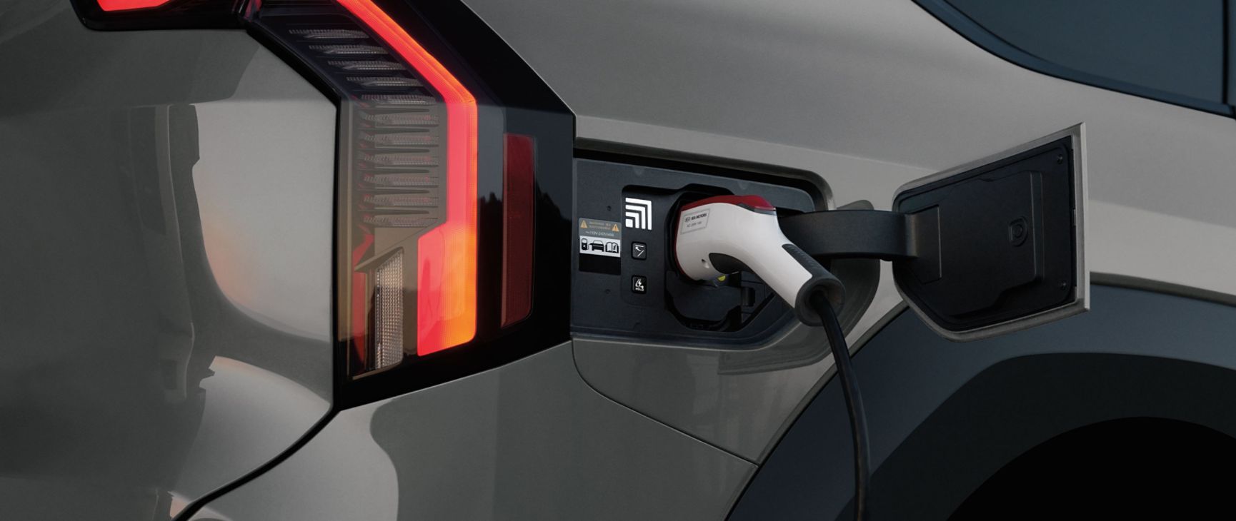 Kia being charged by a fast charger