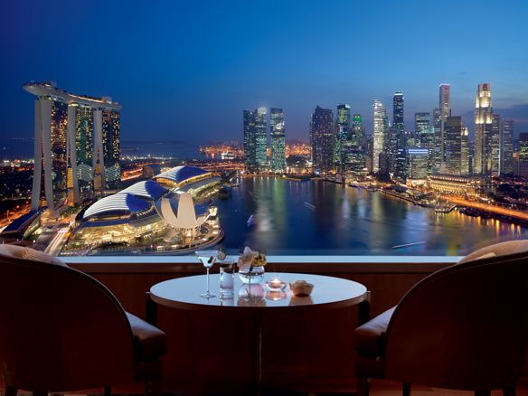 Dramatic view of the sea and city from the Club Level at The Ritz-Carlton, Millenia Singapore