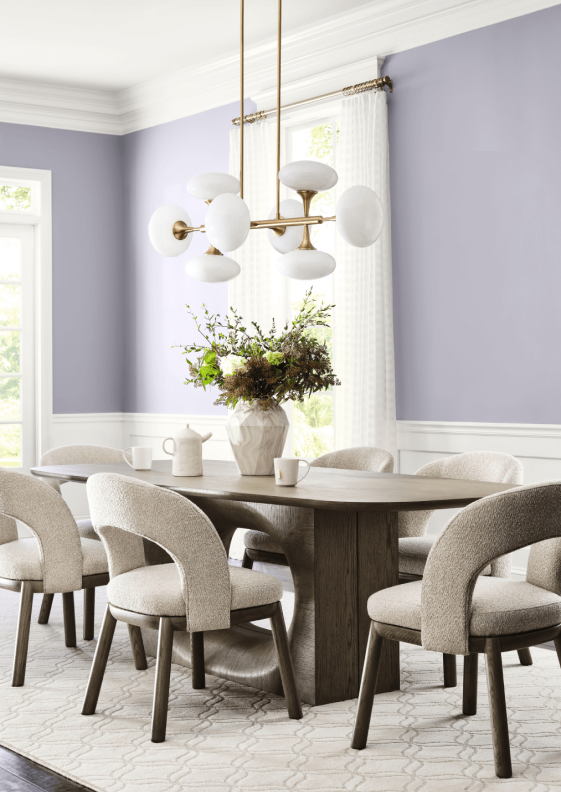 An airy dining room painted in Modern Lavender SW 9688 from the Frosted Tints palette.