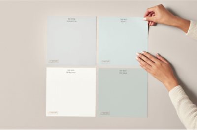 A person laying out 4 color swatches.