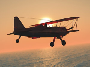 biwing airplane during a sunset