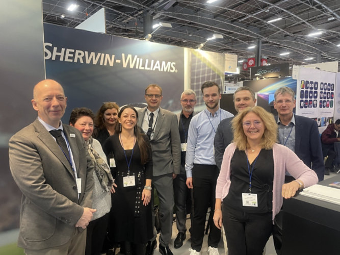 group of people in front of ADF booth