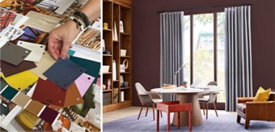 A person sorting through various color chips. A room with a round table, chairs, and floor to ceiling window and shelves.