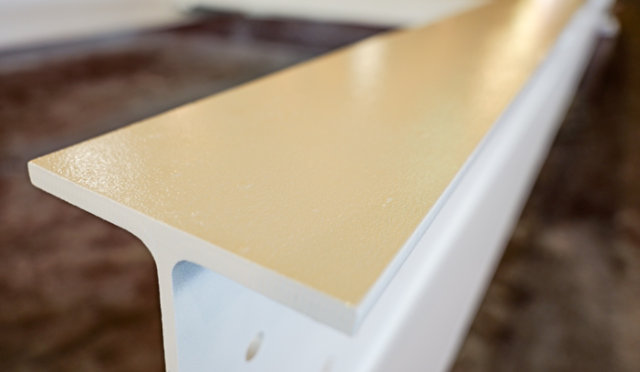 Protective topcaot being on a steel beam