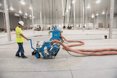 person operating floor grinder
