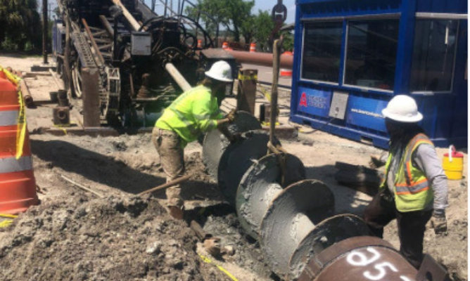 Image of pipe inserting bored hole