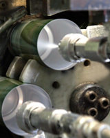 cans being sprayed