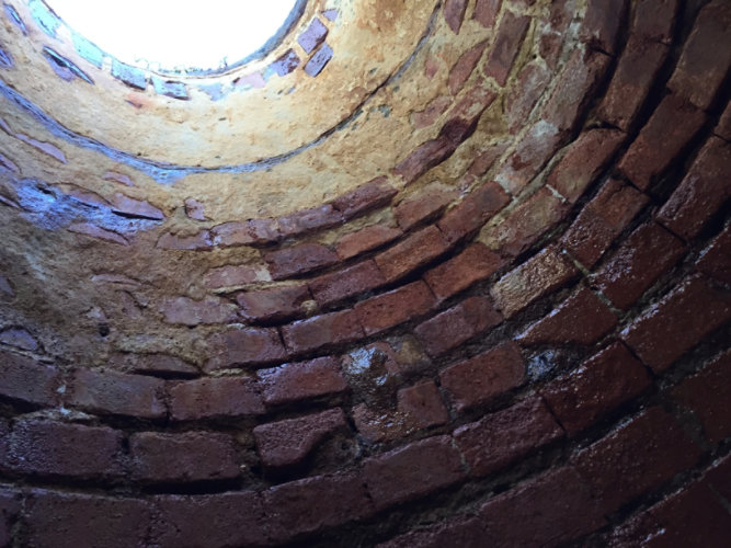 Brick manhole showing cracks and seepage