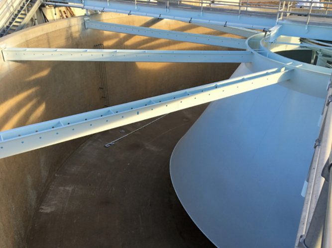 Close up of coated rake arm in an empty clarifyer 
