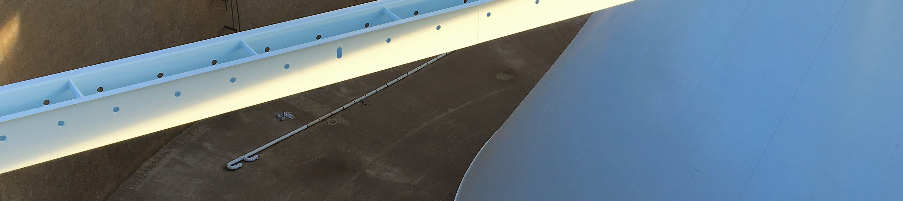 Empty clarifier with topdown view of newly coated rake arm