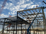 construction site with steel beams being placed