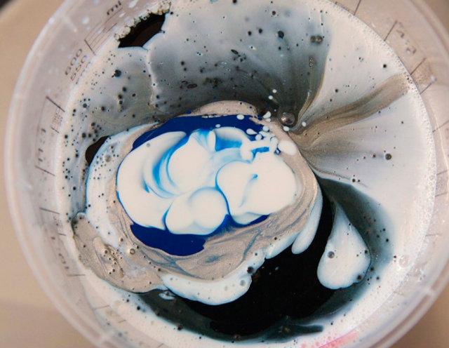 DeBeer paint mixed in a mixing cup