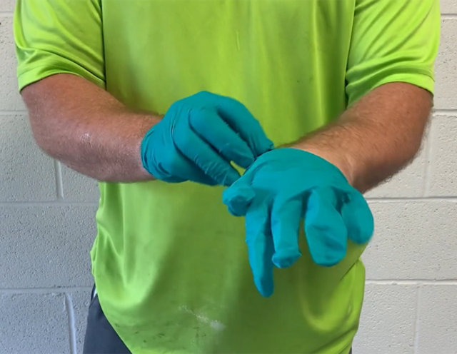 Installer wearing two pairs of gloves