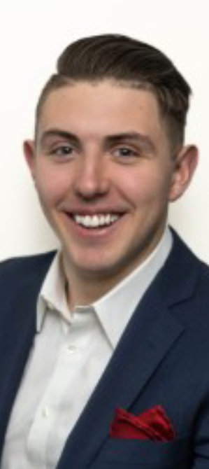 Headshot of Erik McLane against a white background.