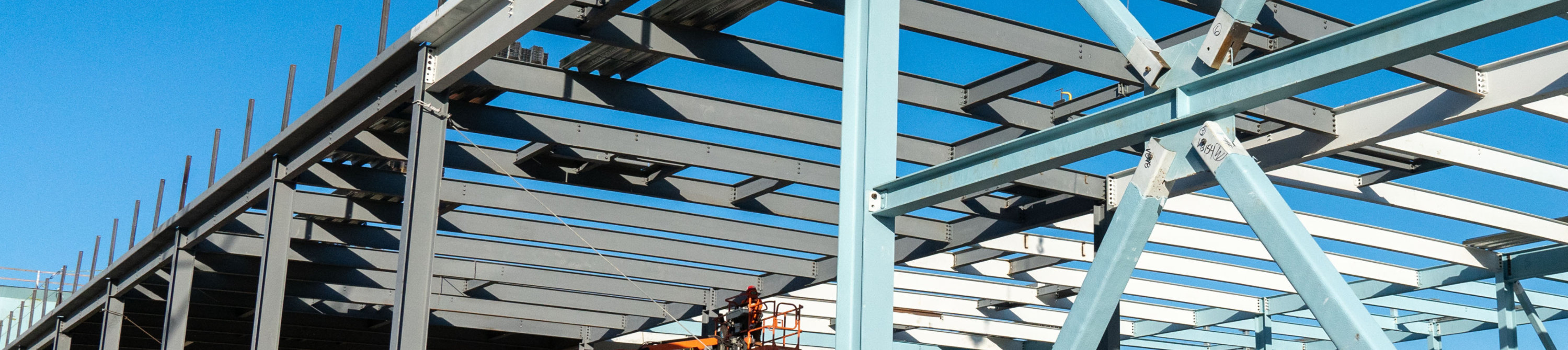 Steel beams with fireproof coatings applied.