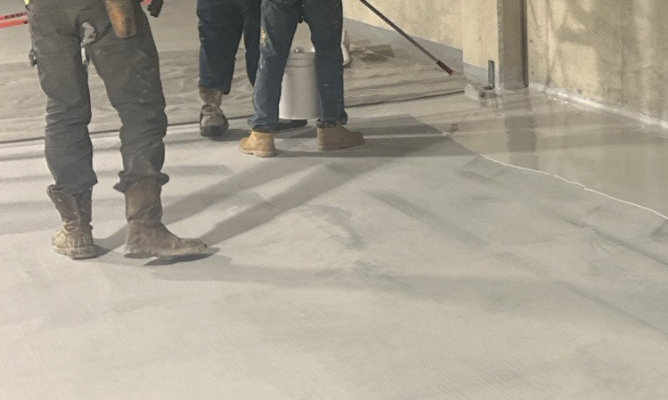 Insallers applying Resudeck MPB.